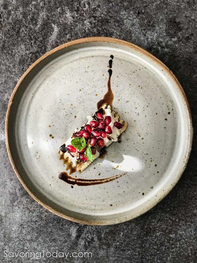 overhead shot of ricotta goat cheese flatbread on a plate.