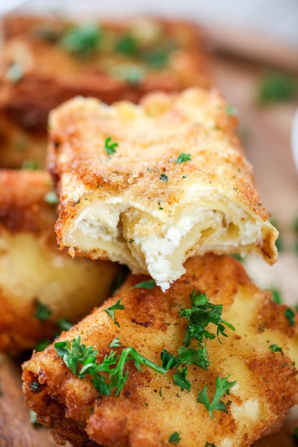 fried lasagna with cheese oozing out.