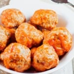 pin showing close-up of turkey meatballs in a bowl with text title overlay.