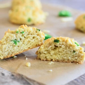 Close-up of an open biscuit on parchment paper to expose the inside.