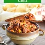 Pin showing pork chili in a bowl with text title overlay.