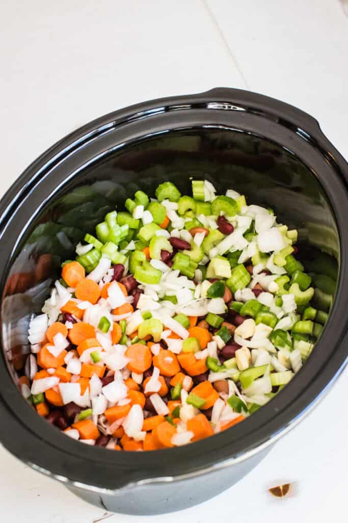 Veggies and beans in a slow cooker.