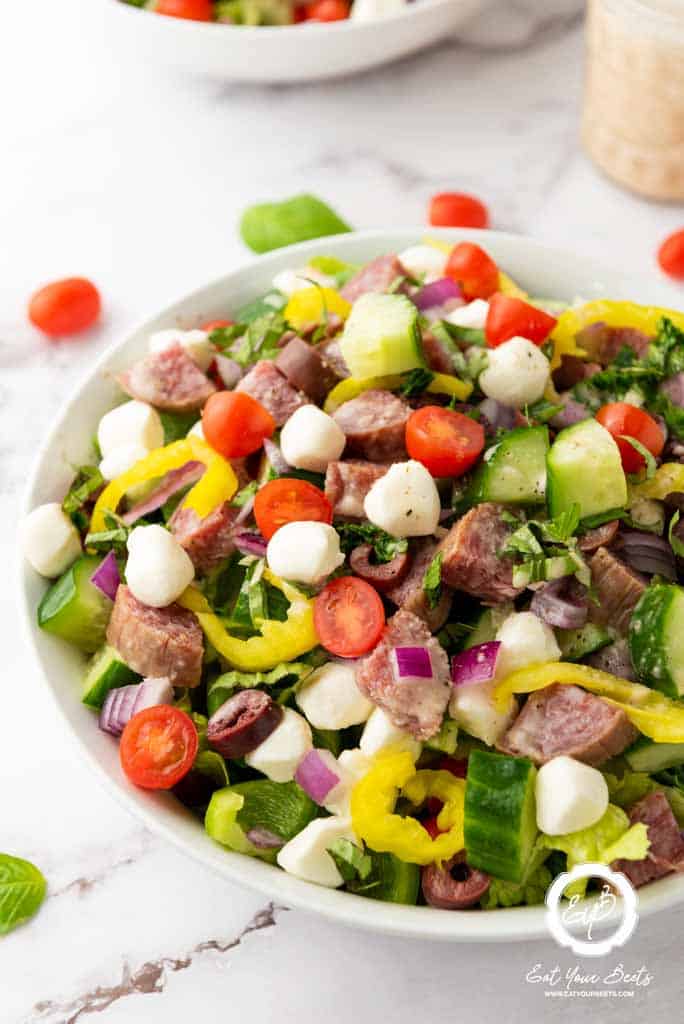 Chopped Italian salad in a white bowl.