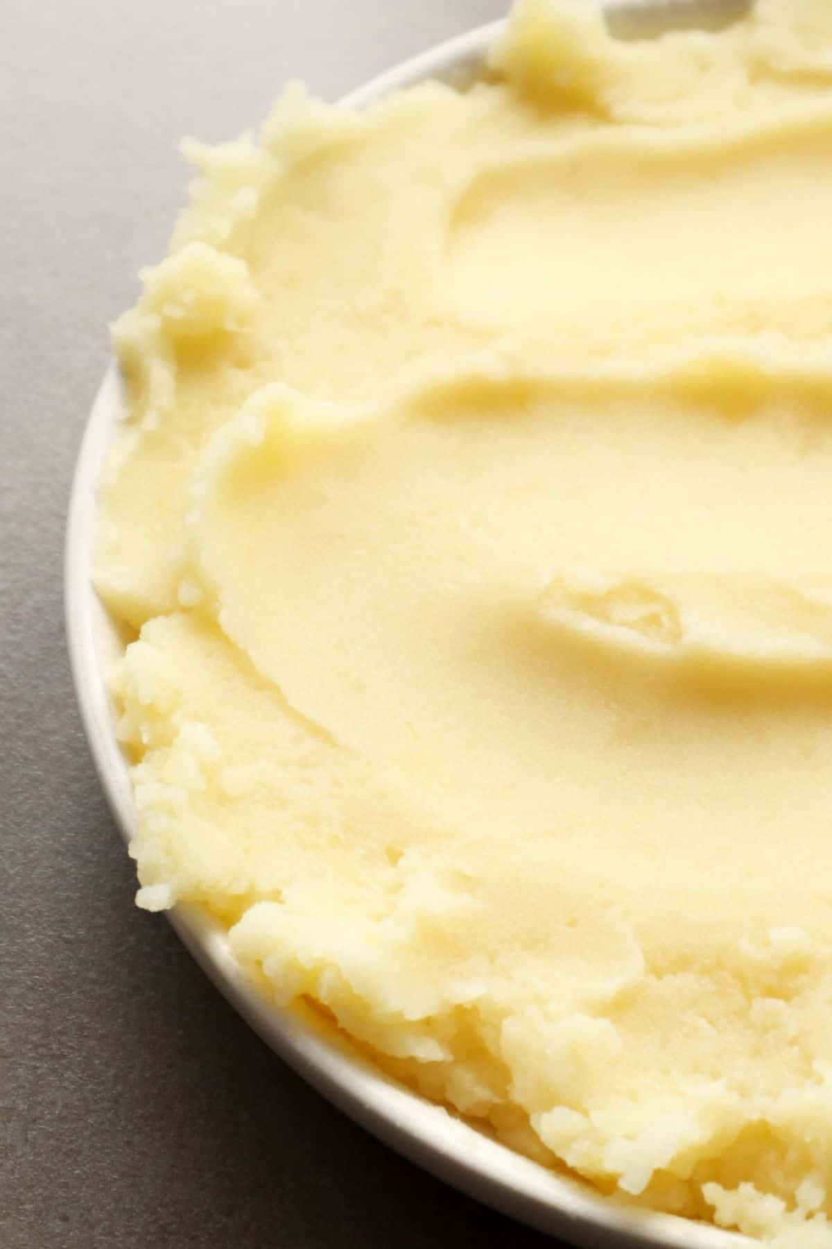 Close-up of almond milk mashed potatoes in a white bowl.