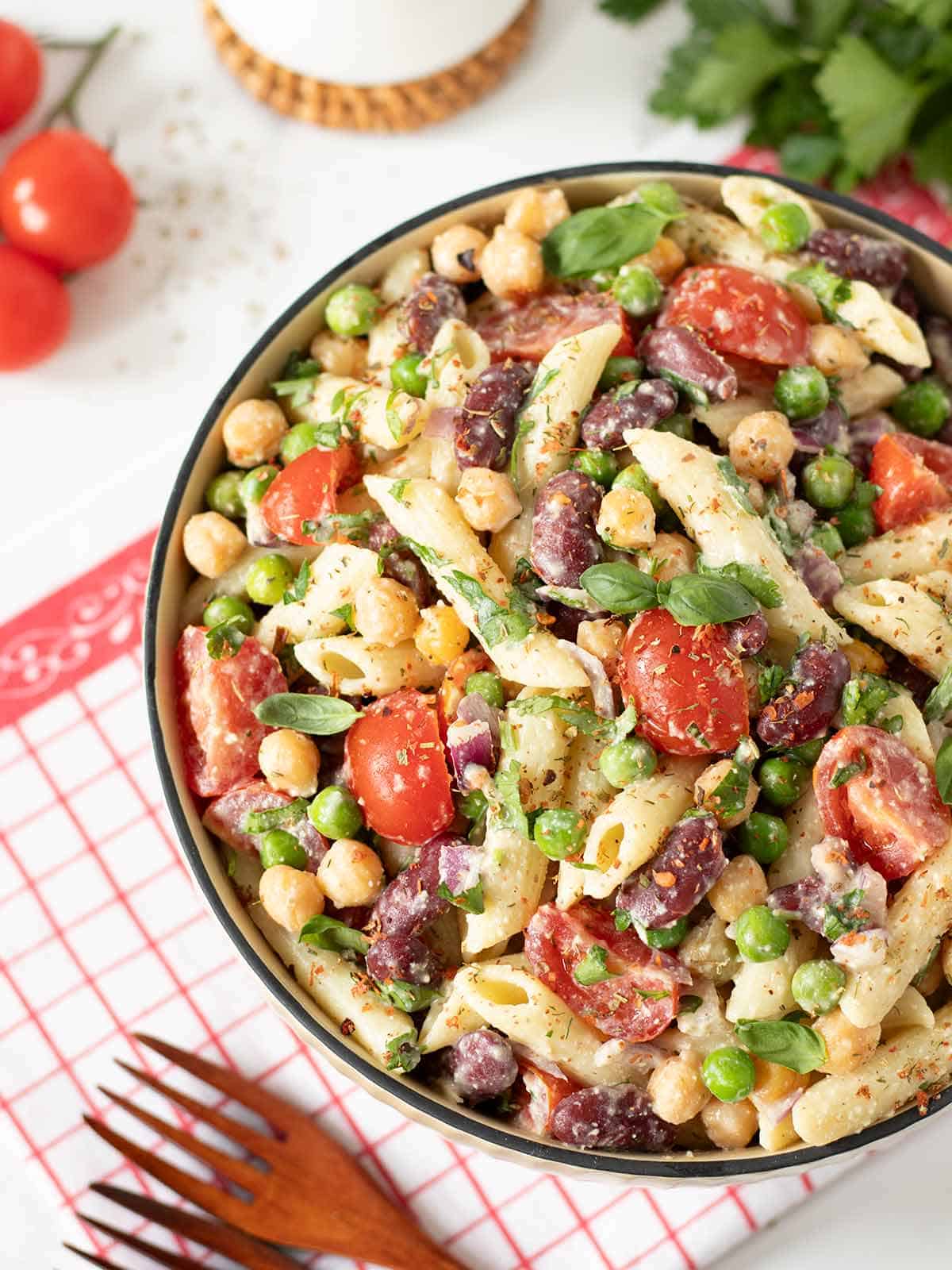 A serving bowl filled with high protein vegan pasta salad.